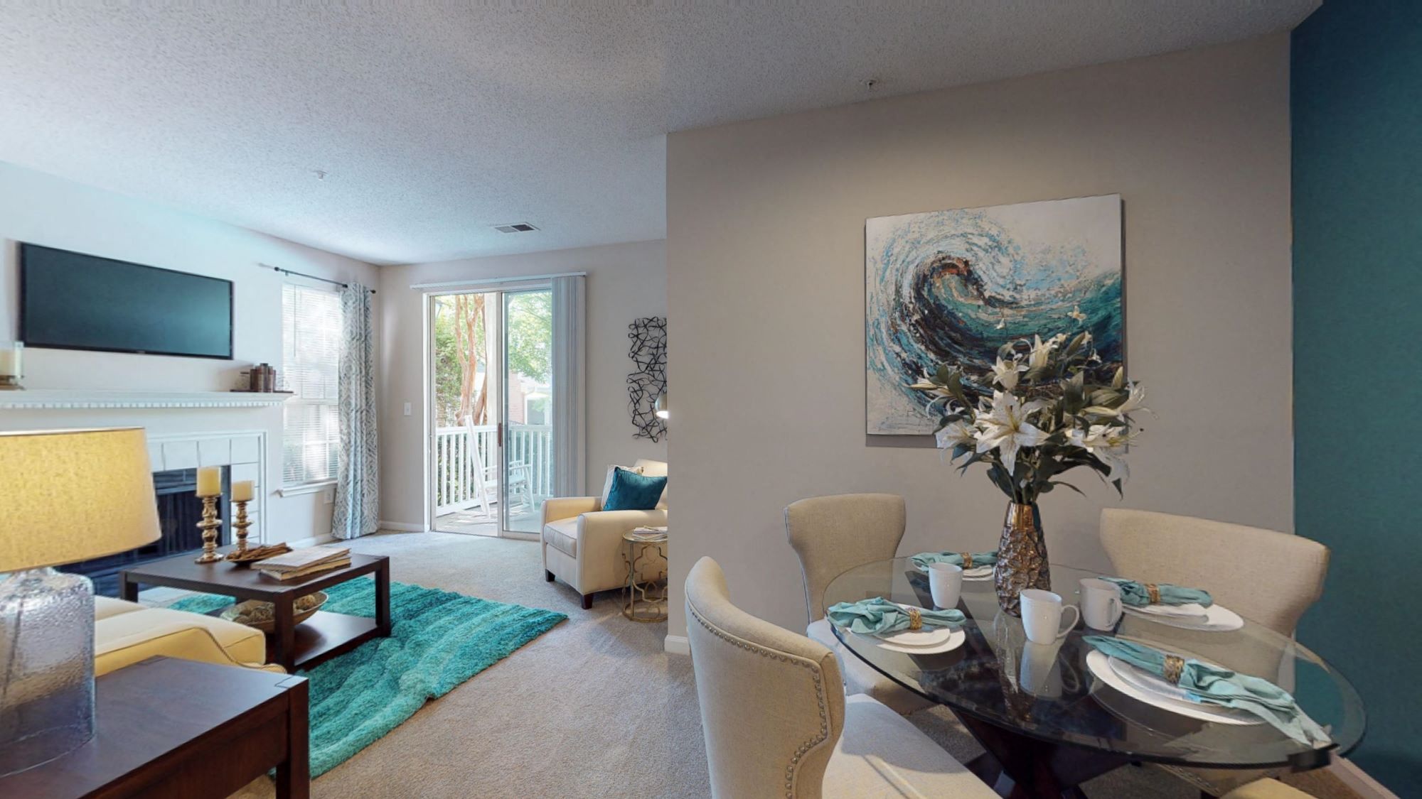 a living room with a table and chairs and a television